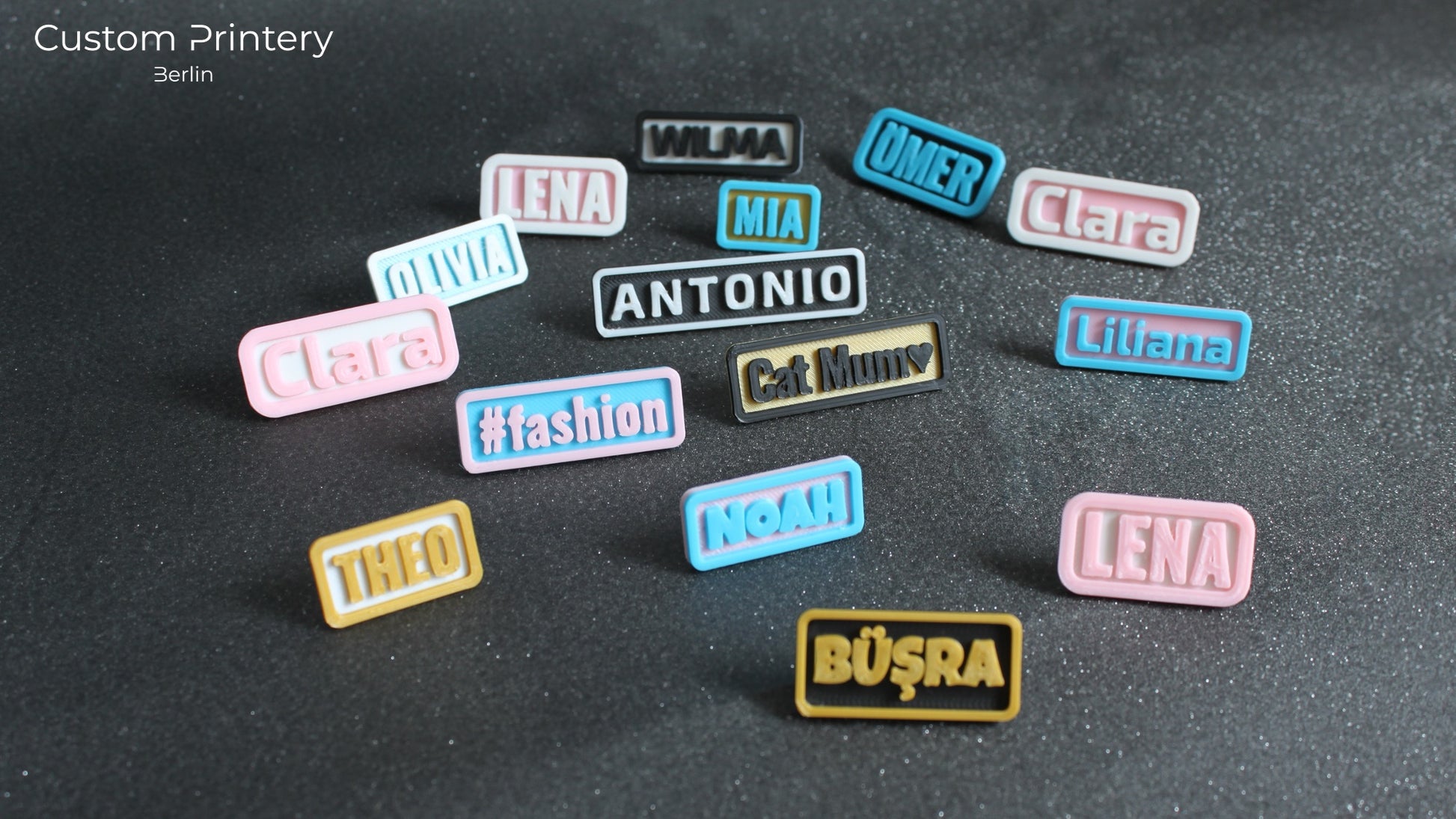 Custom galaxy-patterned Crocs with personalized name charms 'AZRA' and '#fashion' from Custom Printery Berlin, worn with white socks in an indoor setting