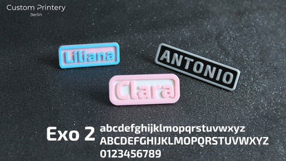 Custom galaxy-patterned Crocs with personalized name charms 'AZRA' and '#fashion' from Custom Printery Berlin, worn with white socks in an indoor setting